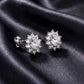 Side profile view of round lab-grown diamond floral halo stud earrings showing post mechanism.