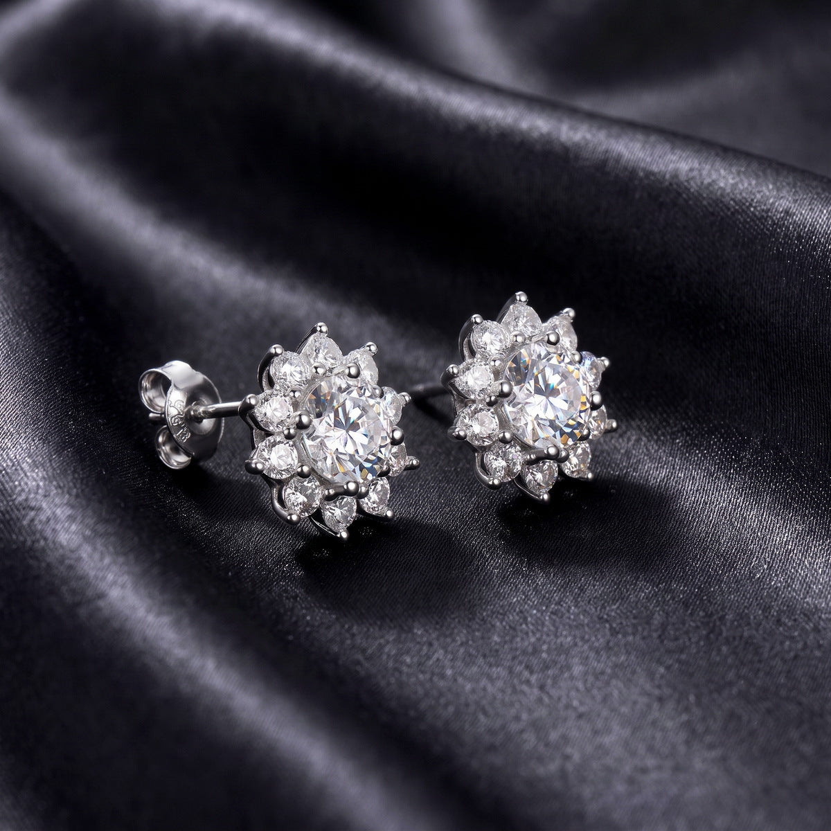Side profile view of round lab-grown diamond floral halo stud earrings showing post mechanism.