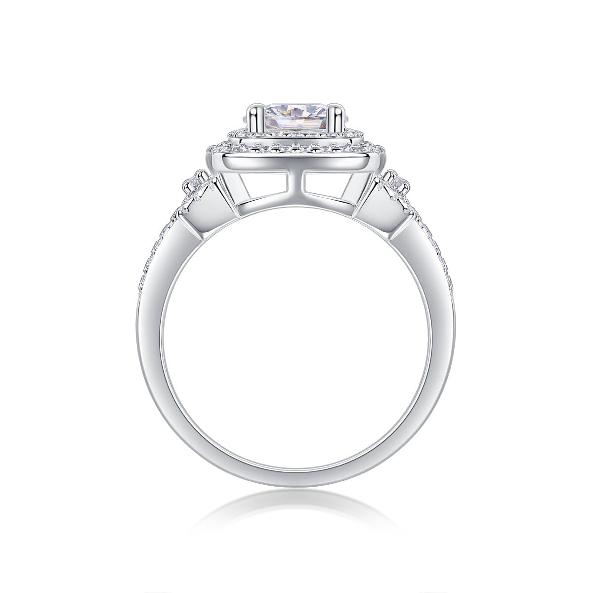 Side profile showing multi-tiered elevated basket and split pave shank on silver ring.