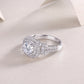 Angled side display of cushion double halo moissanite engagement ring.