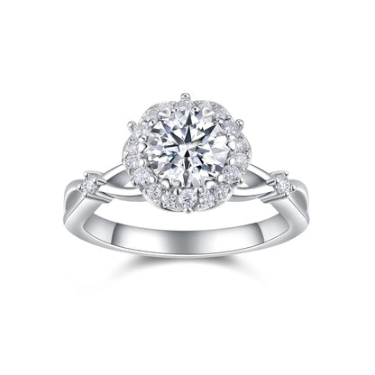 Round moissanite floral halo ring with vine twisted shank on white background.