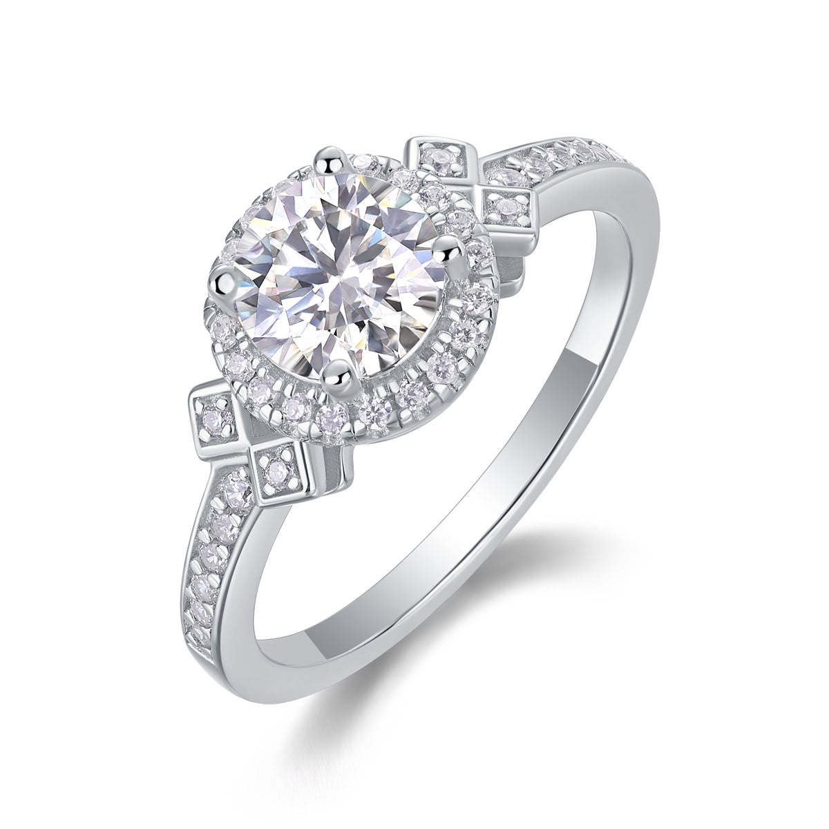 Silver round moissanite engagement ring with geometric halo accent band standing on white surface.