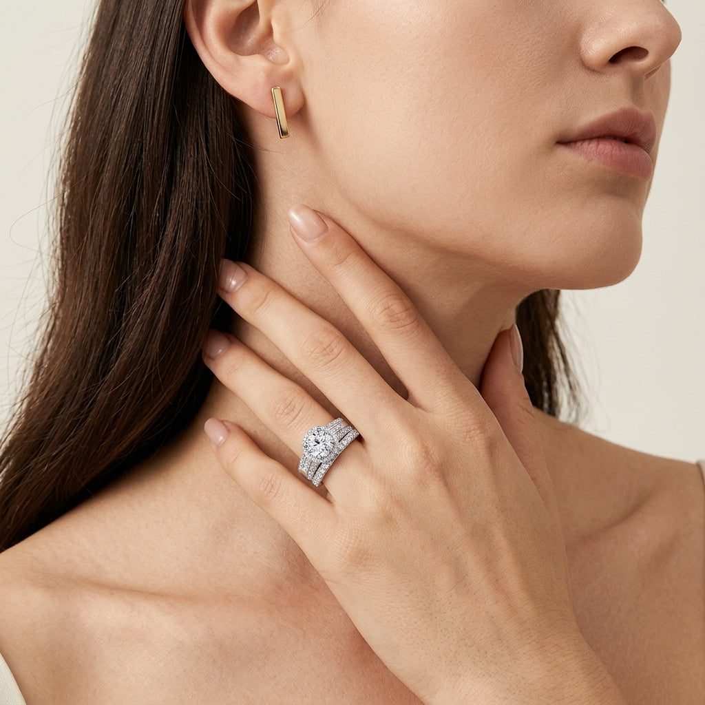 Close-up view of a model wearing luxury round moissanite halo multi-row pave bridal ring set.