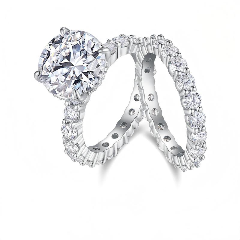 Silver round moissanite engagement ring with hidden halo paired with matching shared prong eternity band.