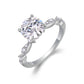 Angled view showing leaf station shank and round moissanite centerpiece.