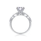 Side profile showing 4-prong basket setting and marquise leaf station band.