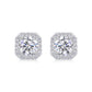 Round cut moissanite stud earrings with octagon cushion halo frame on white background.