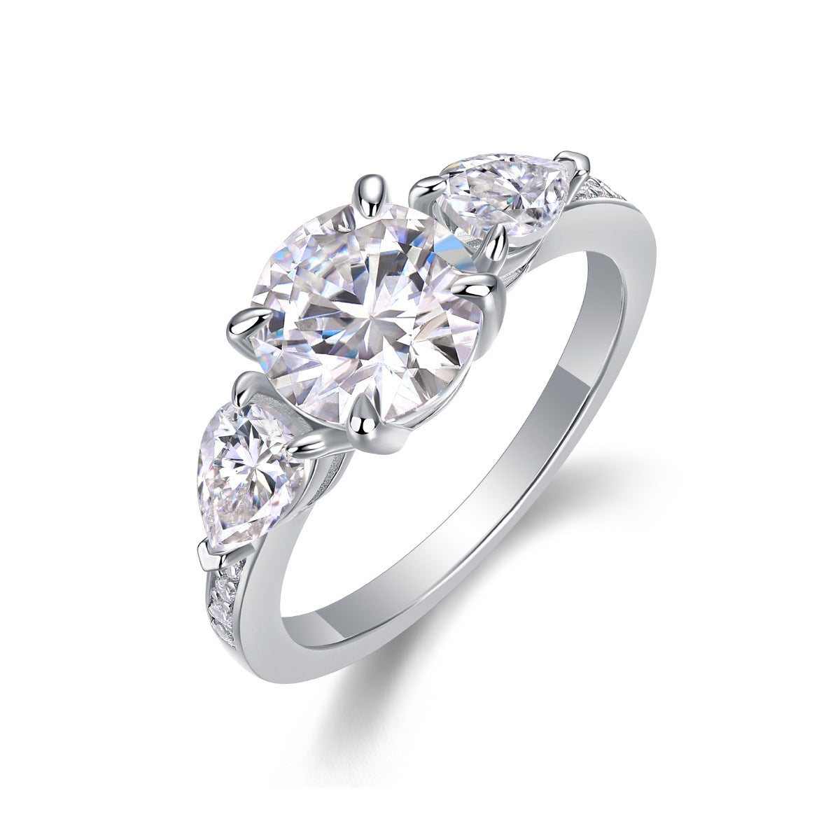 Round moissanite three stone ring with pear cut side gems standing on display.