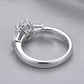 Macro view showing smooth ring band and S925 hallmark on round moissanite three-stone ring.