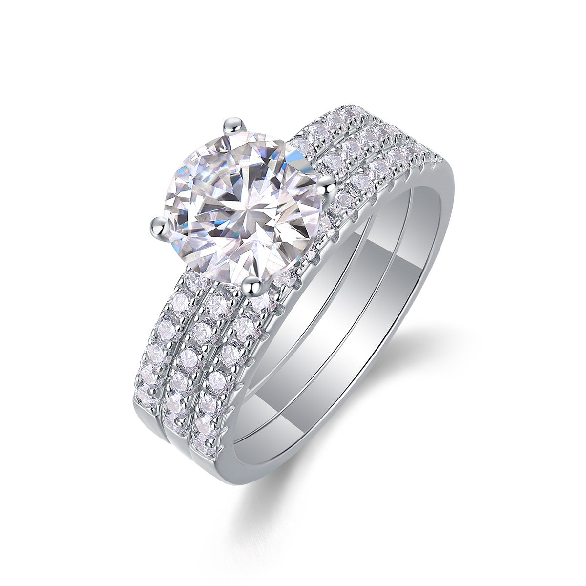Angled view showing two piece round moissanite engagement ring and pave band set.
