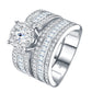 Angled view showing round moissanite halo ring with wide channel-set baguette wedding band.