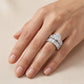 Model showing round cut moissanite wide baguette stacking bridal set on hand.