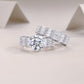 Two piece wide baguette moissanite bridal ring set resting on decorative background.