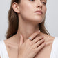 Lifestyle view of model showcasing round solitaire pave stacking ring set.