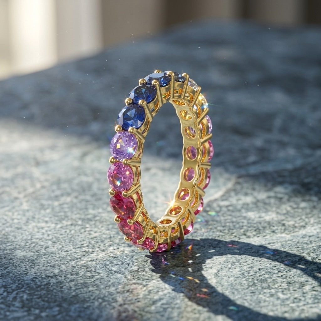 Gold round rainbow gradient moissanite eternity band ring showing blue and purple gradient on stone