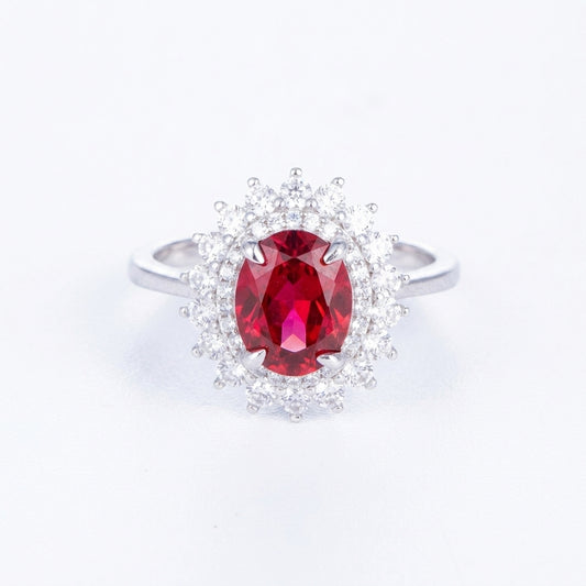 2ct oval-cut ruby Diana halo statement ring with sparkling diamond imitation border.