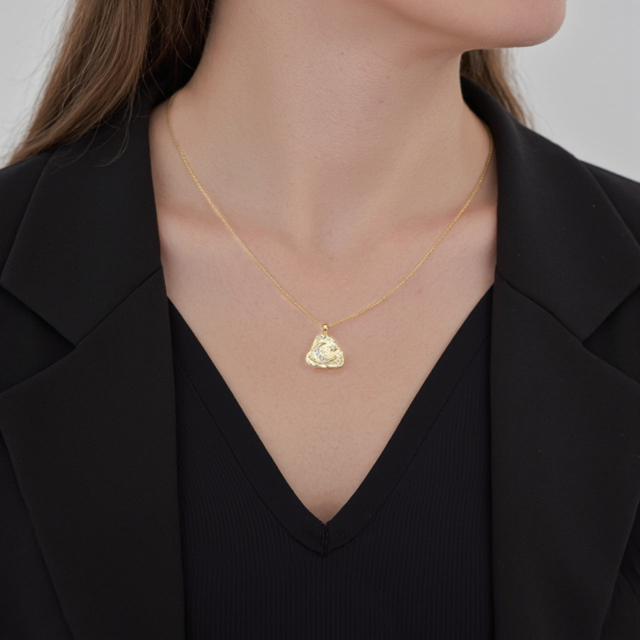 Woman Wearing Minimalist Silver Moon Necklace