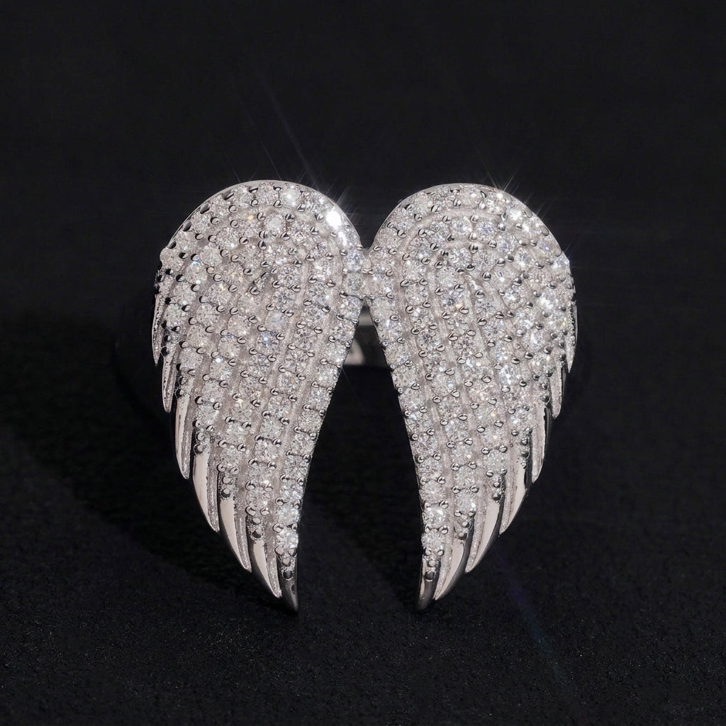 S925 sterling silver full iced out moissanite angel wings ring on dark background