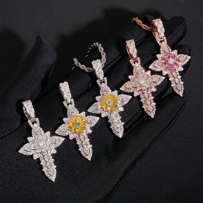 Hand in black glove holding S925 silver moissanite floral cluster cross pendants in pink yellow and clear stones