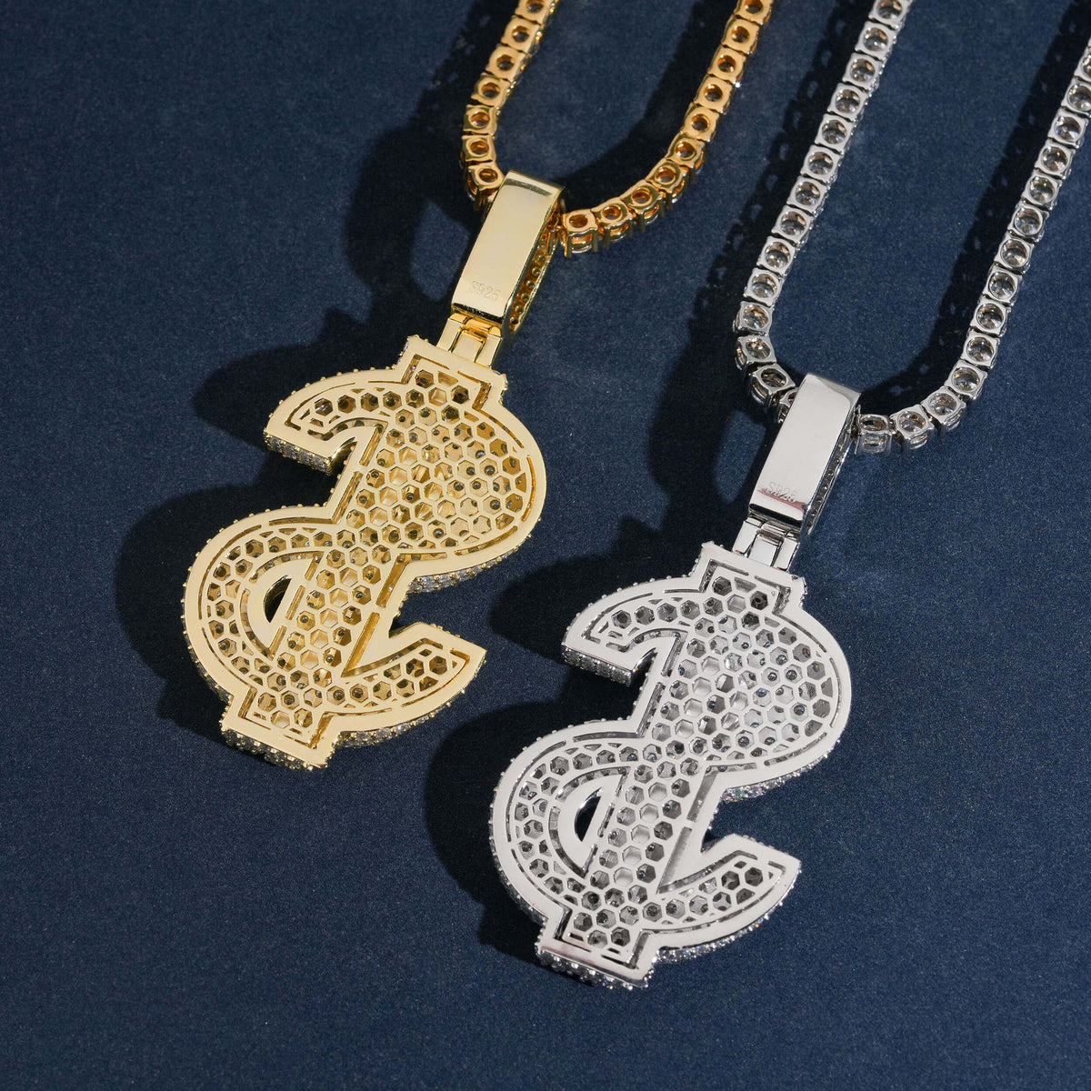 Gold and silver S925 iced out moissanite 3D dollar sign pendants with franco chains on dark surface