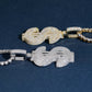 Side view showing 3D thickness of S925 silver iced out moissanite dollar sign pendants in gold and silver