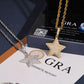 S925 silver iced out moissanite 3D star pendants in gold and silver placed on GRA certificate booklet
