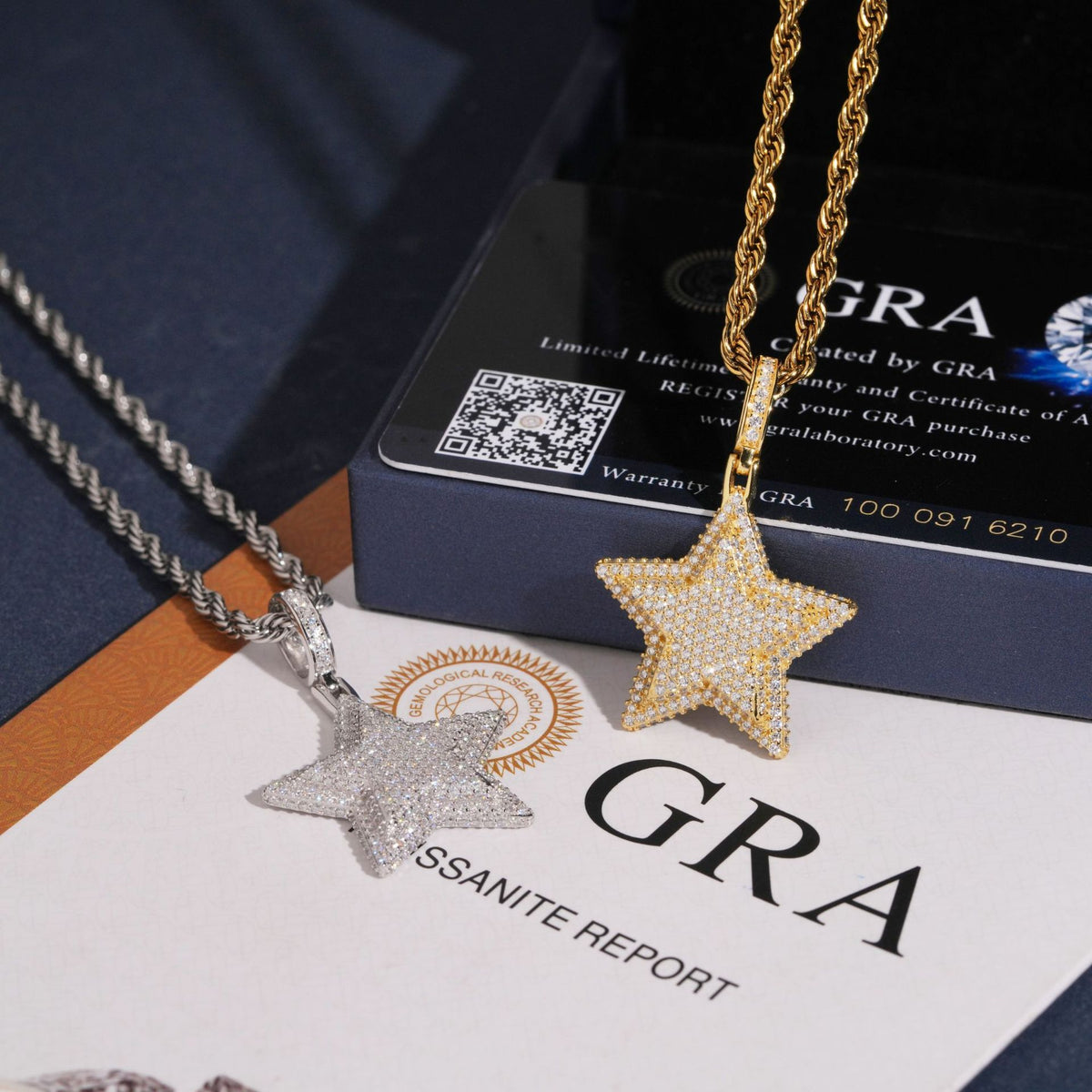 S925 silver iced out moissanite 3D star pendants in gold and silver placed on GRA certificate booklet