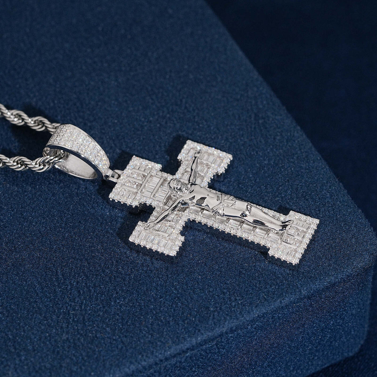 S925 silver iced out moissanite baguette crucifix cross pendant with rope chain on dark blue display surface