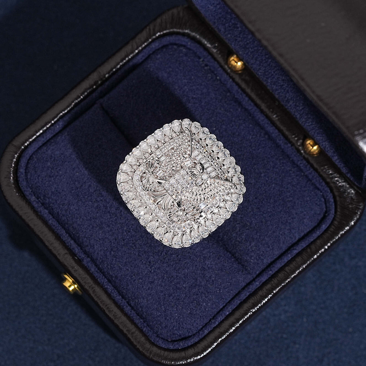S925 silver iced out moissanite eagle cushion signet ring displayed in luxury blue box