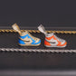 Enamel sneaker moissanite pendants in orange and blue displayed with silver and gold rope chains   