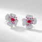 Close-up of secure butterfly push-back closure on ruby stud earrings.