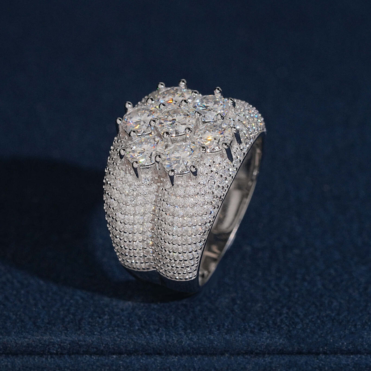 Side profile view showing micro pave band and flower cluster centerpiece of moissanite ring