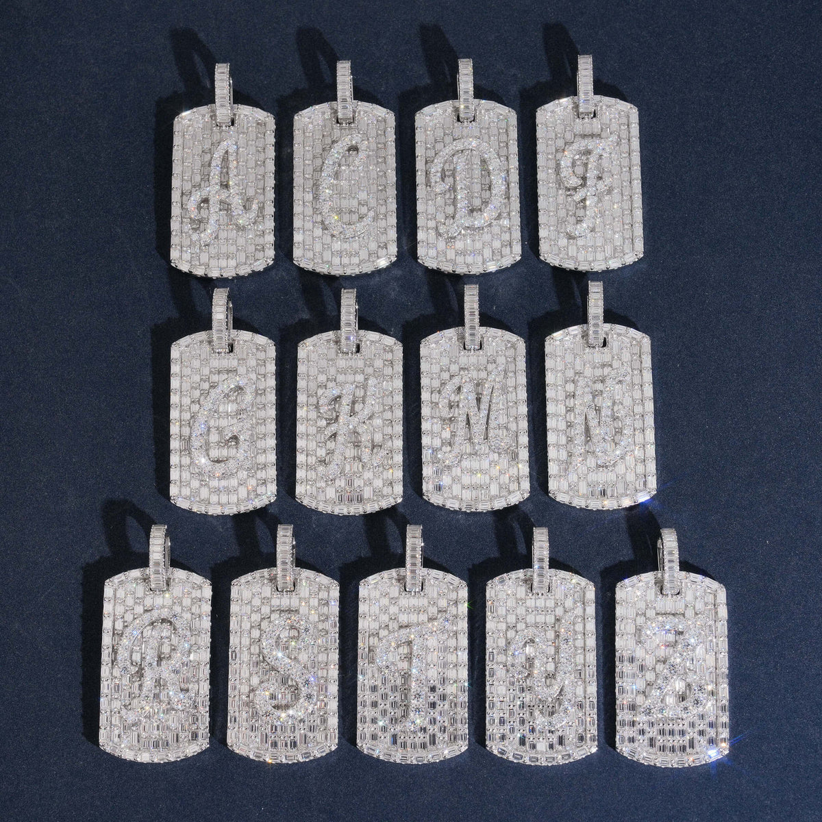 White gold S925 silver iced out moissanite baguette initial dog tag pendants arranged in ordered grid