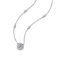 Detailed view of silver moissanite halo pendant and station chain accents.