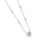 Silver moissanite halo solitaire station necklace laying on plain surface.