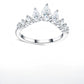 Front view of silver pear shaped moissanite tiara crown curved wedding band on white background.