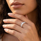 Model wearing silver pear cut moissanite tiara crown stacking ring in a studio portrait.