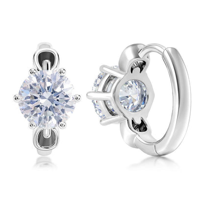 Six-prong round diamond solitaire huggie hoop earrings in platinum-plated sterling silver.