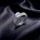Stacked round lab grown diamond solitaire and pave wedding band set on dark silk.