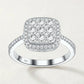 Studio front display of sterling silver sugar cube double cushion halo moissanite cluster engagement ring.