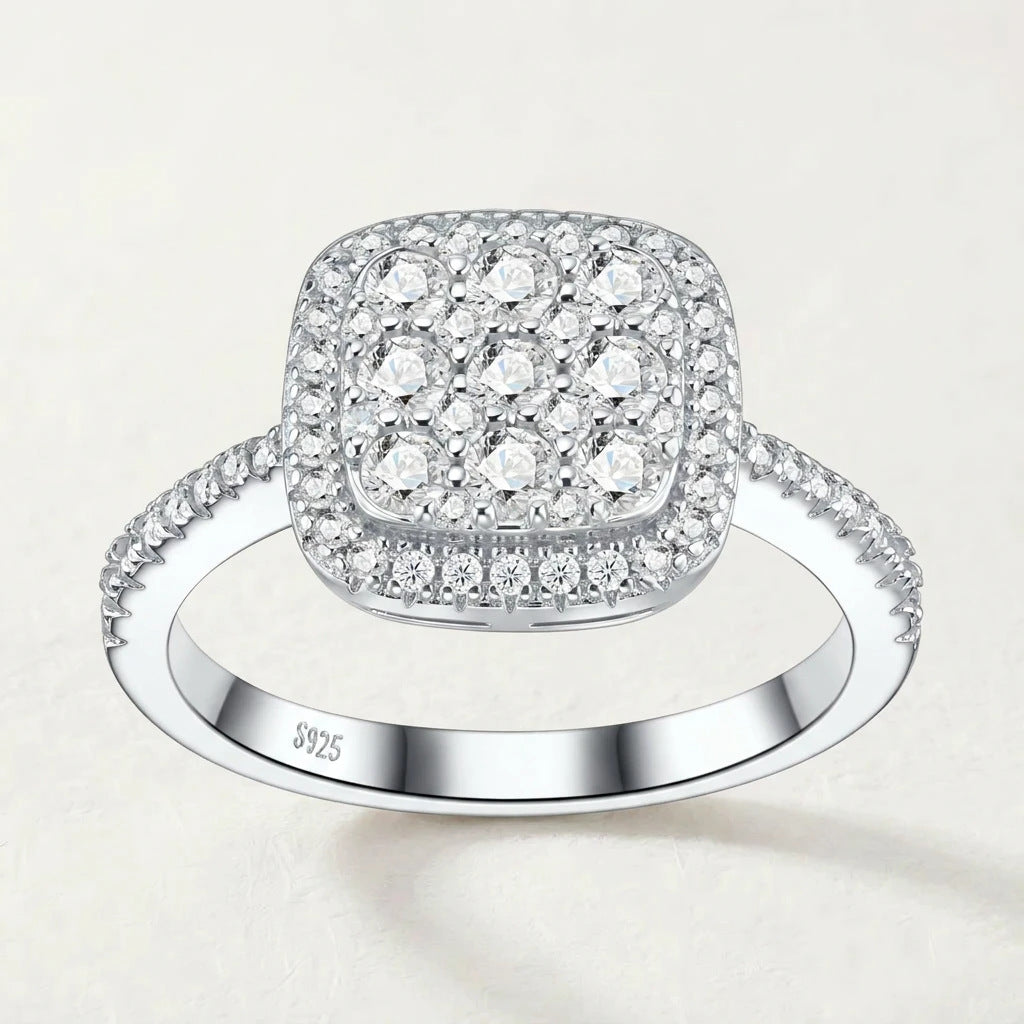 Studio front display of sterling silver sugar cube double cushion halo moissanite cluster engagement ring.