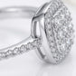 Studio macro close-up highlighting the raised cushion halo profile, stone basket setting, and pave-set moissanite band.