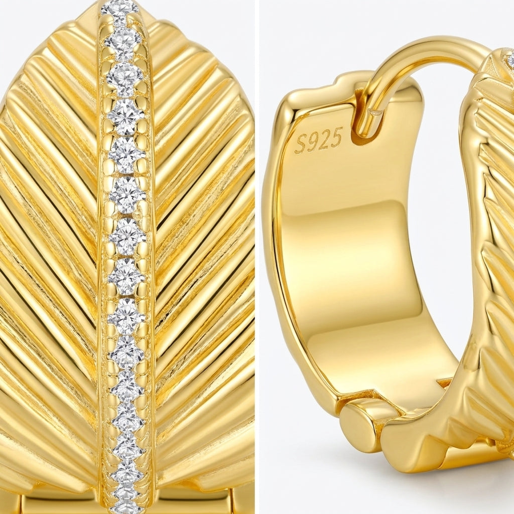 Detailed close-up of gold textured leaf huggie hoops showing the pavé moissanite spine and S925 stamp.