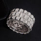 Top view showing circle profile and inner band design of three row watch link moissanite ring