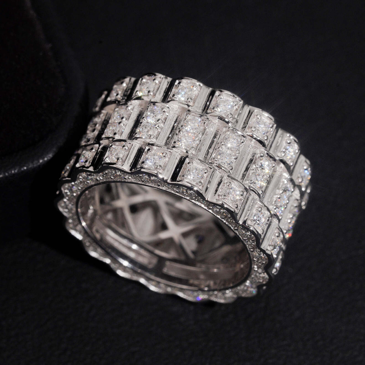Top view showing circle profile and inner band design of three row watch link moissanite ring