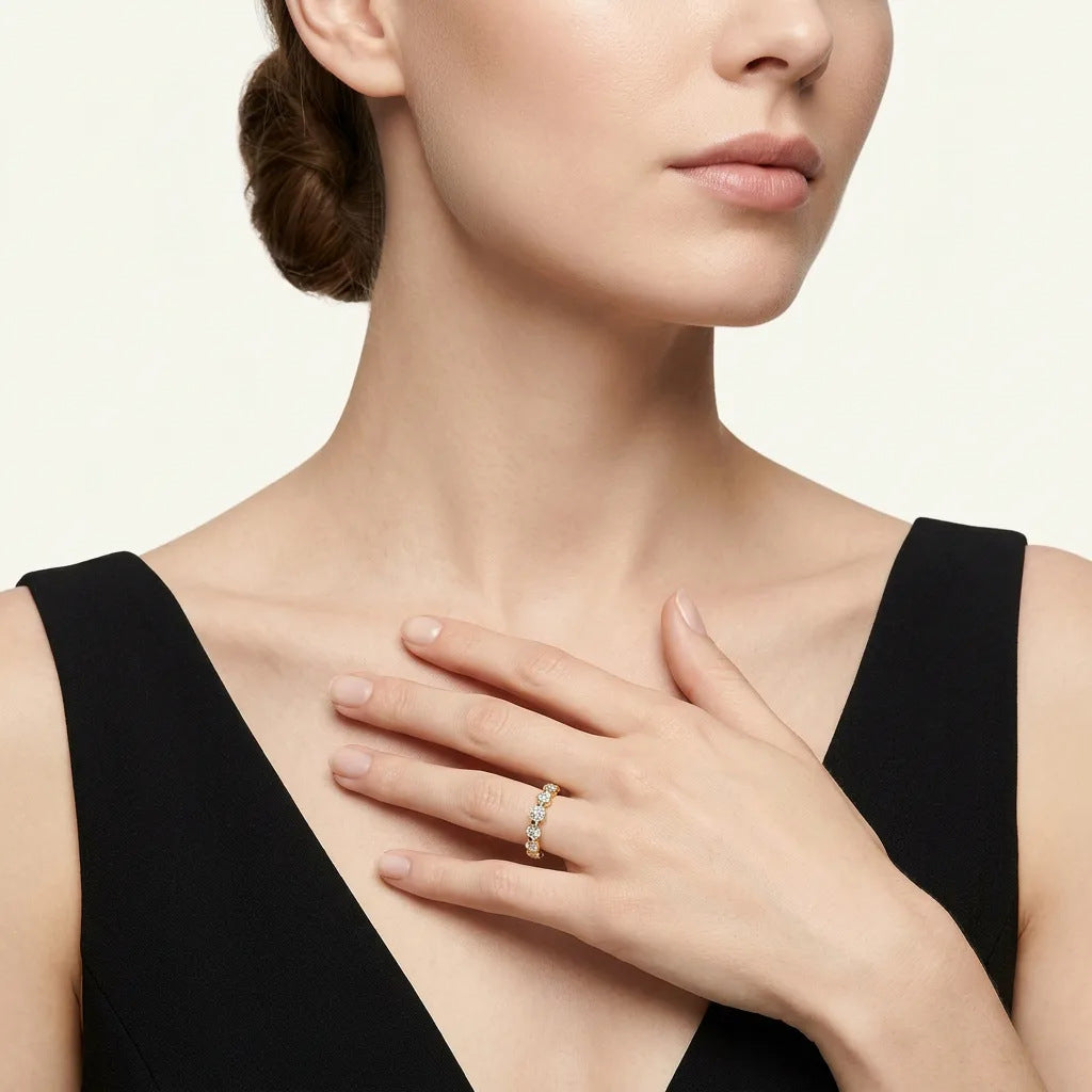 High-end editorial lookbook shot of a model wearing a timeless minimalist round gemstone eternity statement jewelry ring with a black dress.