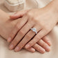 Premium lookbook wear shot of a model's hands gracefully displaying a timeless romantic round gemstone solitaire wedding stacker ring.