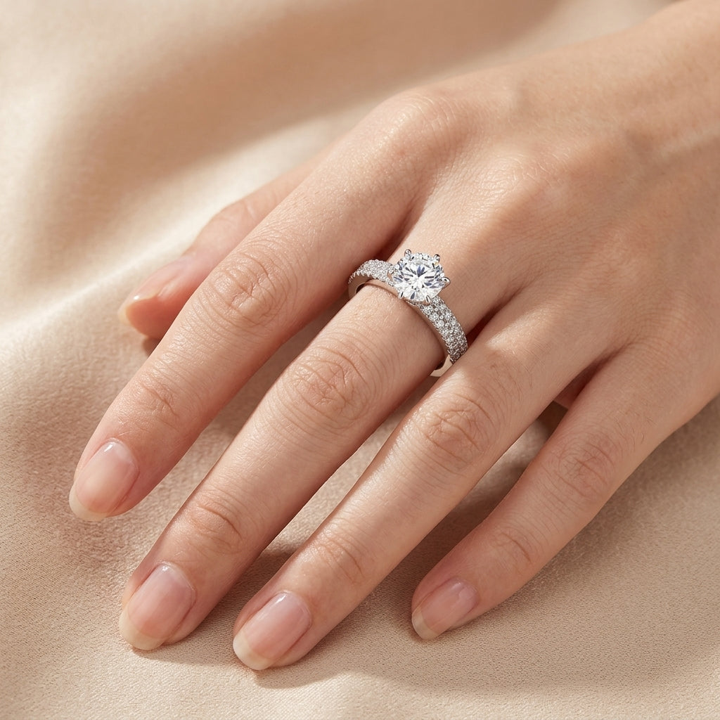 Closeup lookbook wear shot of a model's hands gracefully displaying a timeless romantic vintage six-prong solitaire wedding stacker ring.