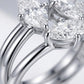 Macro side profile showing 4-prong basket settings and polished bands on Toi et Moi ring.