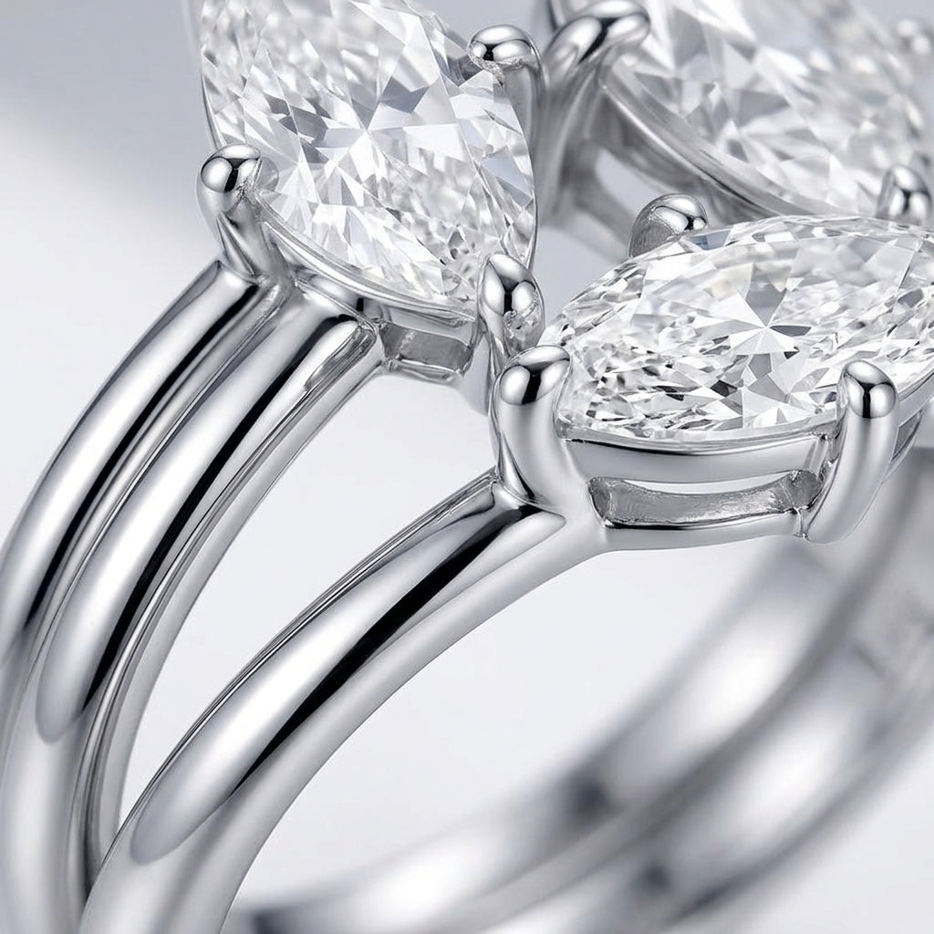 Macro side profile showing 4-prong basket settings and polished bands on Toi et Moi ring.